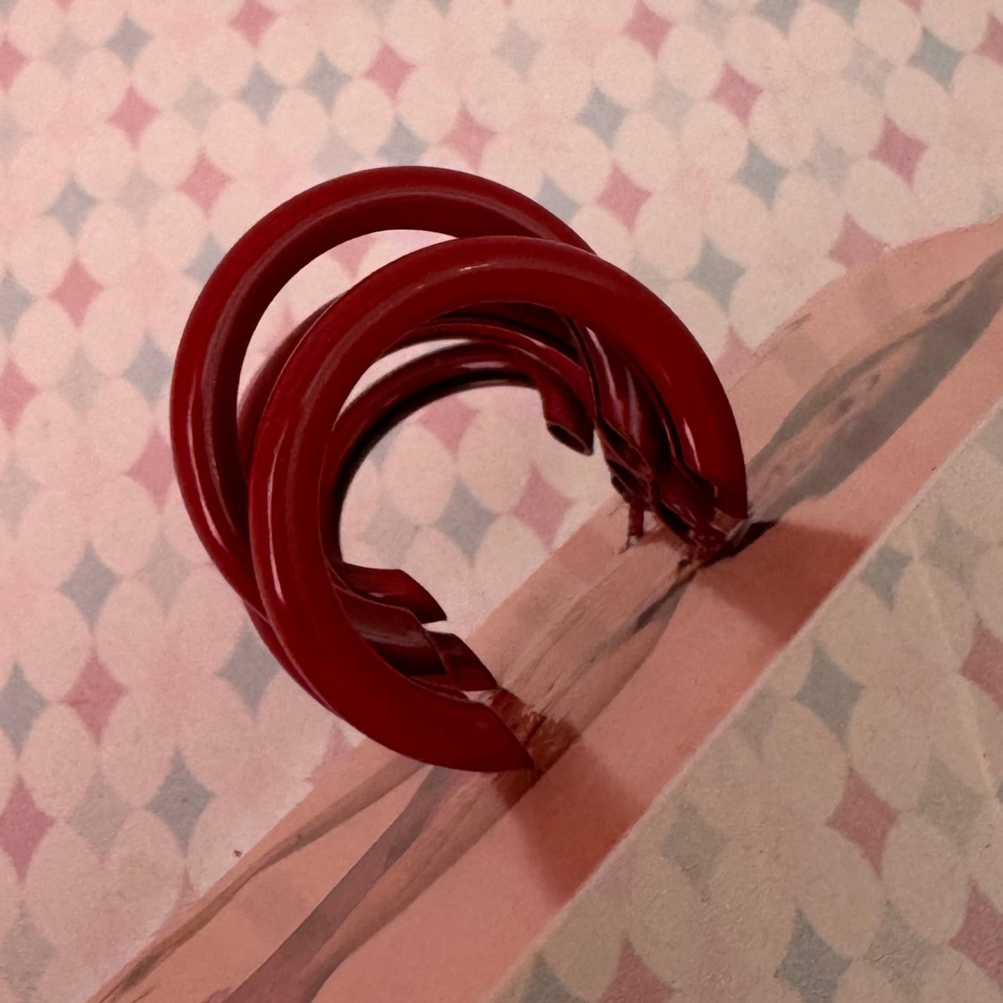 Red metal triple loop earrings