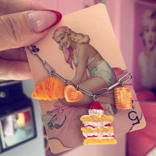 Hand holding a card with a vintage-style illustration of a woman and food items.