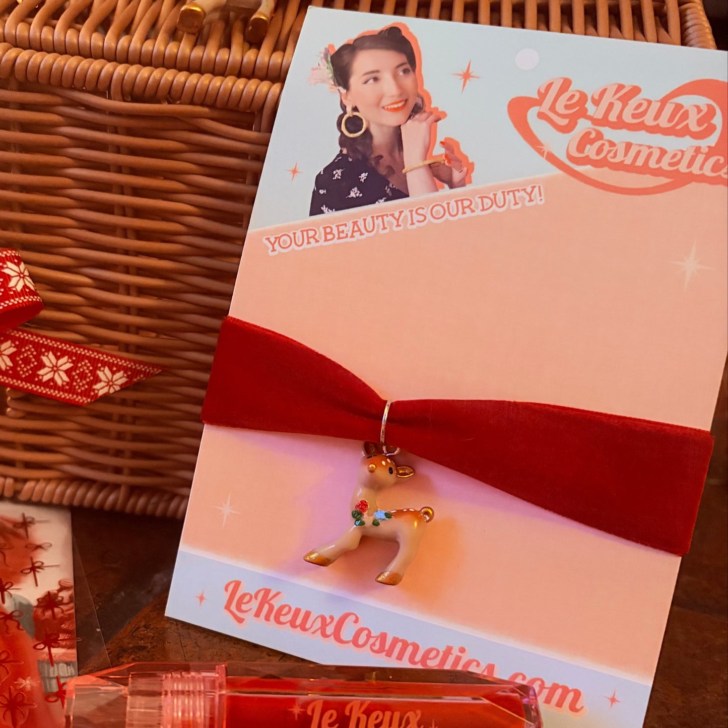 Le keux Cosmetics product with packaging and wicker basket on a wooden surface